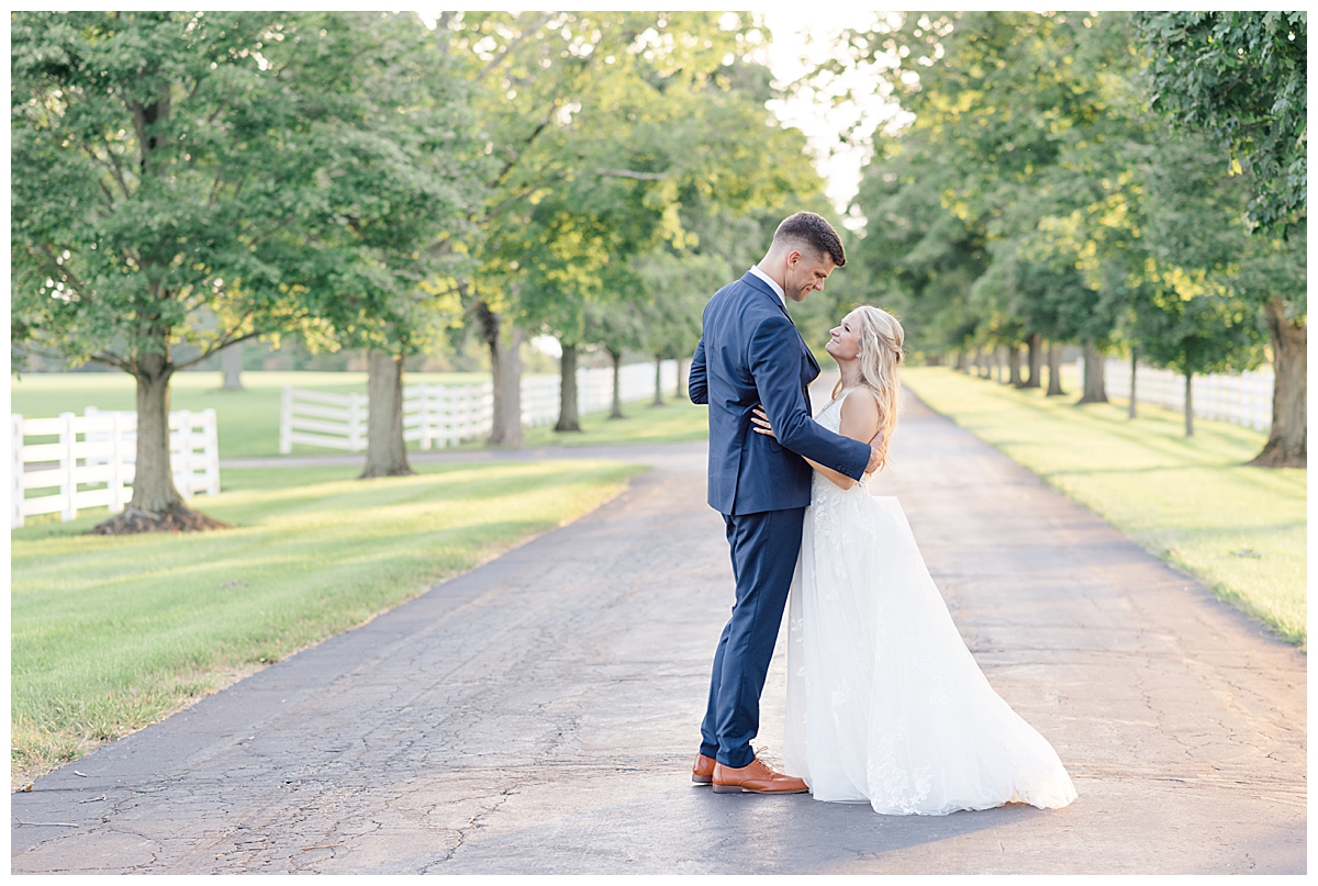 bride and groom dancing on tree line path at darby house in columbus, ohio