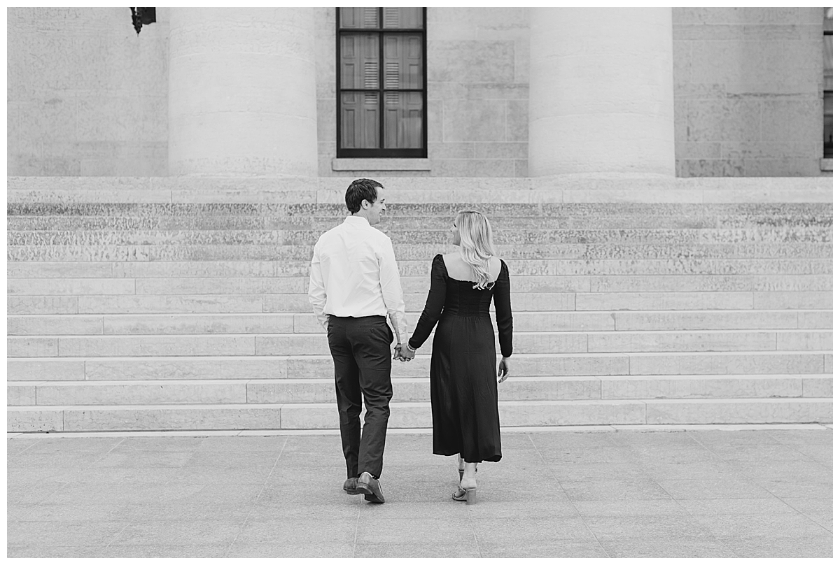 Walking couple at engagement session in Capital Square in Columbus, Ohio