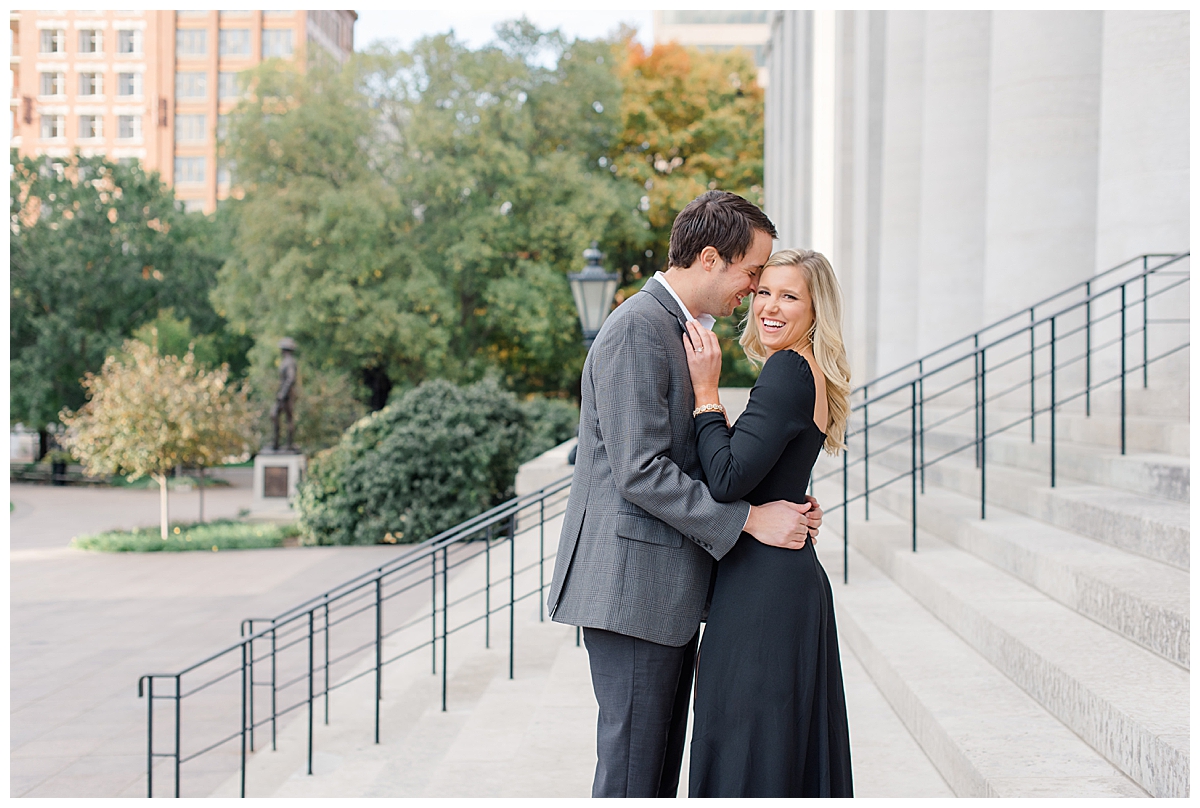 couple smiling during engagement session at Capital Square in columbus, ohio