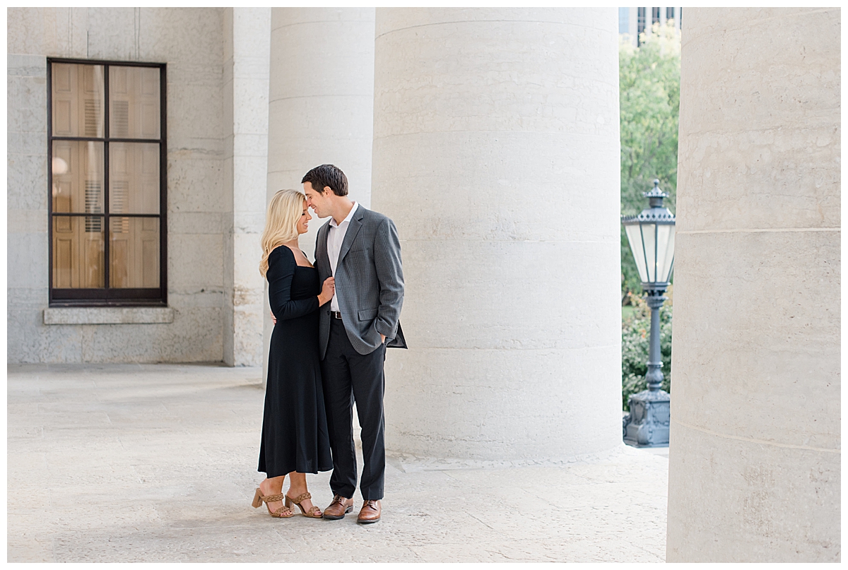 Couple looking at each other during an Ohio State House engagement session in Columbus, Ohio taken by Ohio wedding photographer Ashleigh Grzybowski