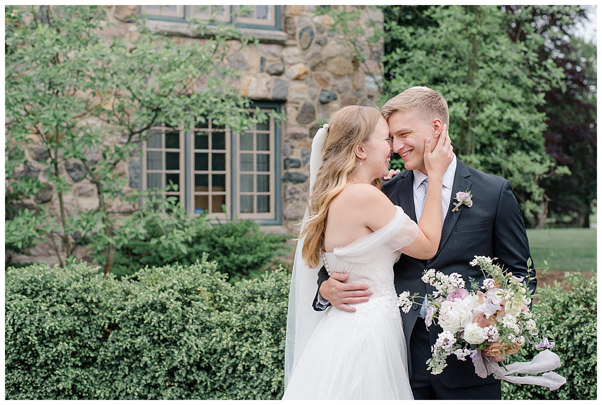 Bride and groom smiling at each other at Beverly Mansion wedding in Columbus, Ohio taken by Ohio Wedding Photographer Ashleigh Grzybowski