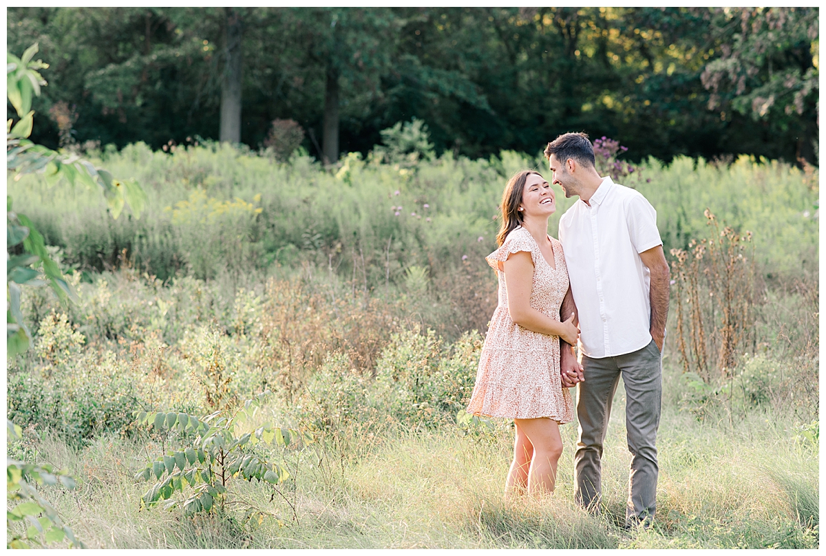 Bride smiling at groom at High Banks Metro Park in Columbus, Ohio during an engagement session taken by Ohio Wedding Photographer Ashleigh Grzybowski