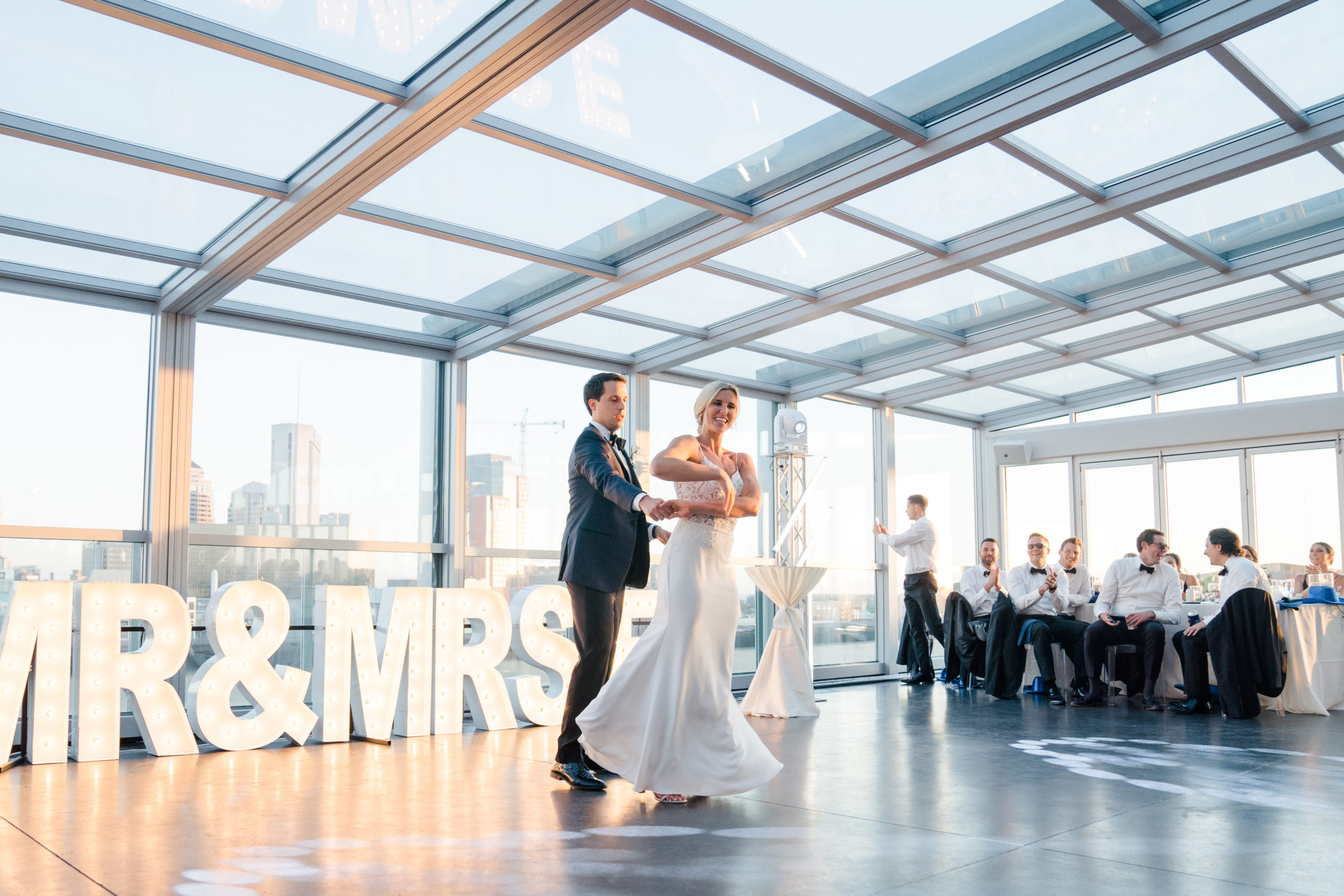 Bride and groom dancing at Revery a columbus, ohio wedding venue with a glass roof top taken by ashleigh grzybowski an ohio wedding photographer