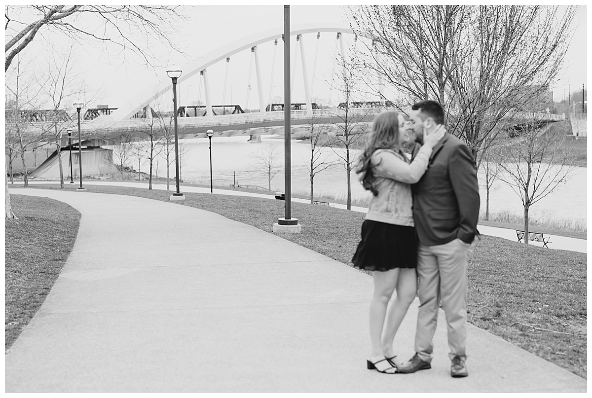 Couple kissing at Scioto Mile after proposal in Columbus Ohio taken by Ohio wedding Photographer