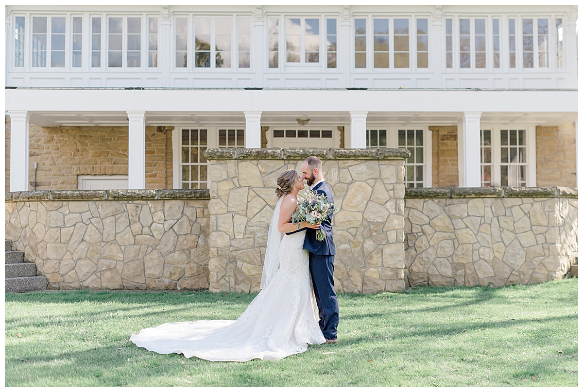 Bride and Groom kiss at the Bryn Du Mansion estate in Columbus, Ohio photographed by Ashleigh Grzybowski