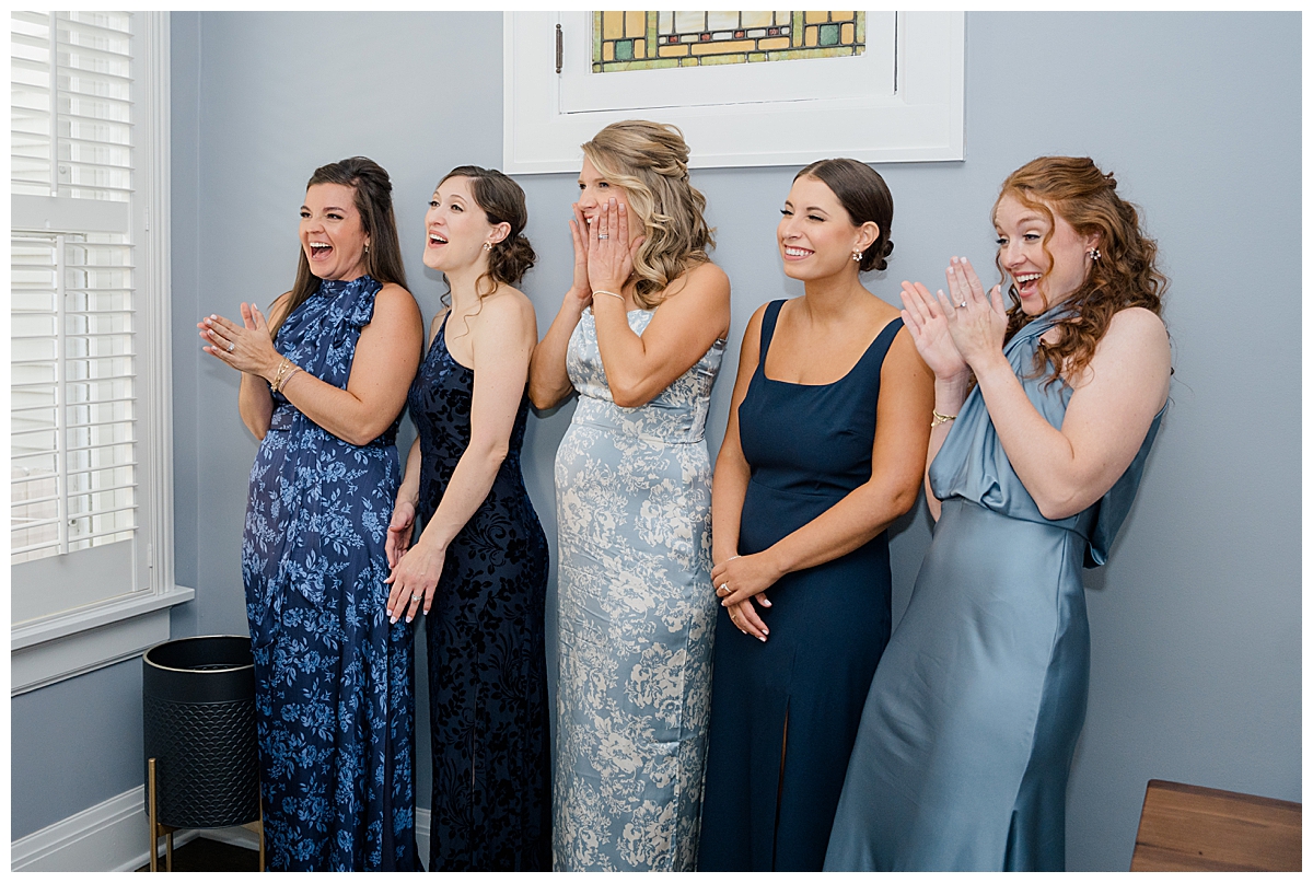 Bridesmaids reacting to bride during first look