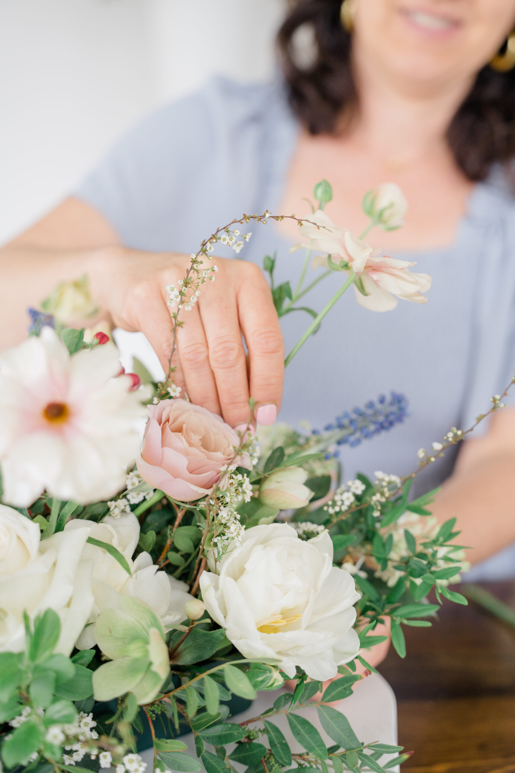 featColumbus photographer captures candid brand image of a woman arranging flowers