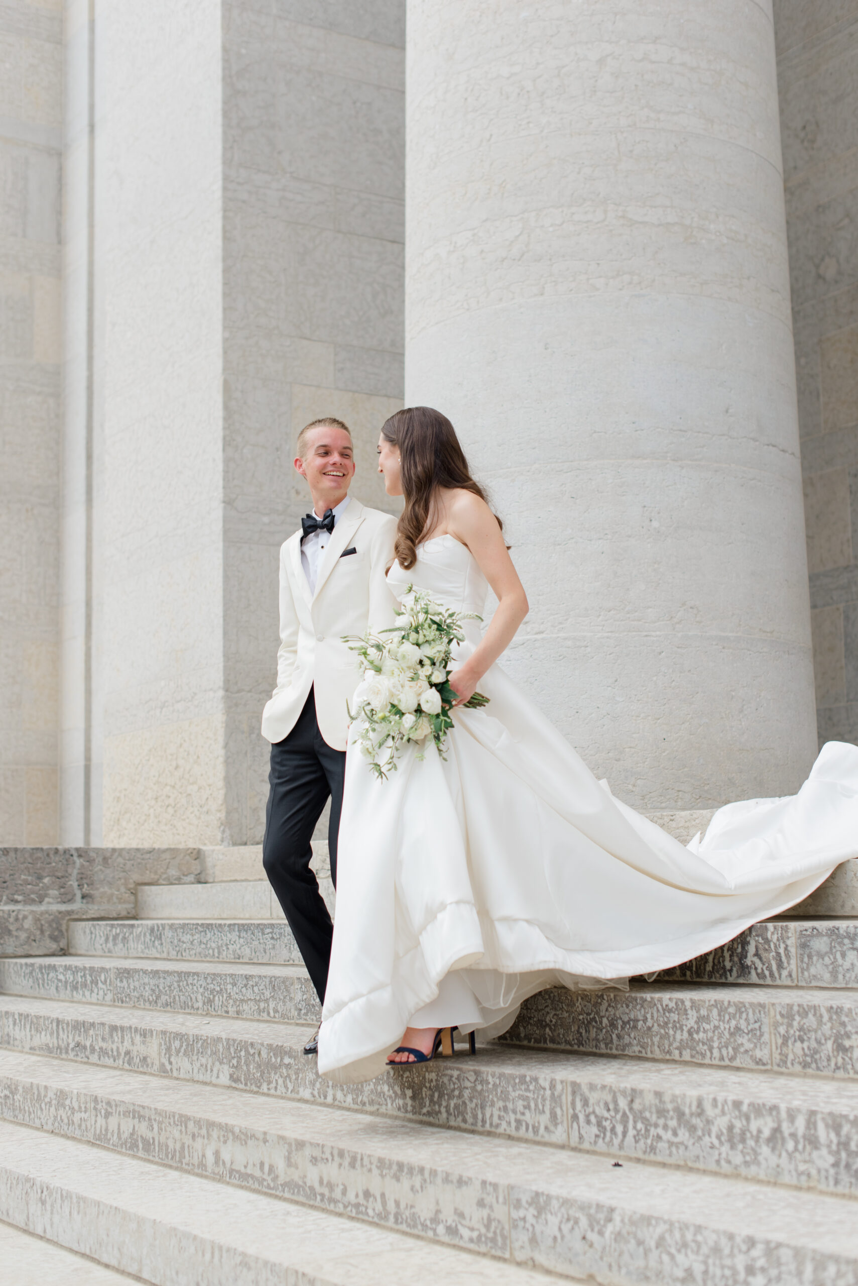 bridal portrait of bride and groom on the stairs of Ohio State House photographed by Columbus wedding photographer